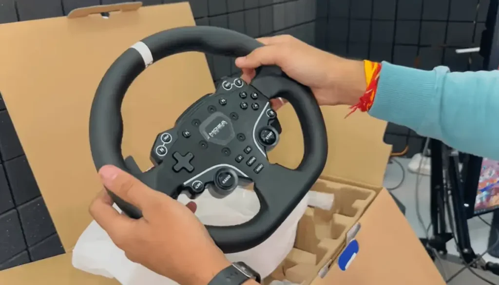 MOZA R5 racing wheel close up showing steering rim design, premium build quality and direct drive motor base